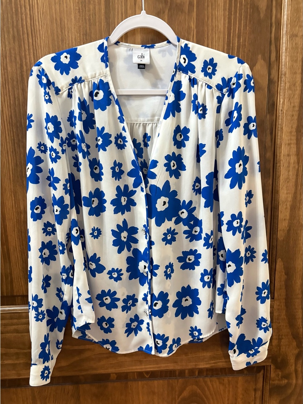 CAbi White Blouse with Bold Blue Floral Print size, M.